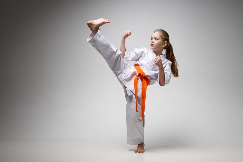 Strong,Kick,In,Karate,Training,,Sporty,Little,Girl.
